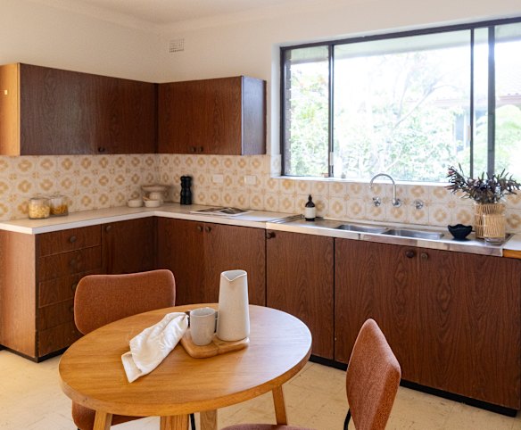 The mid-century apartment is in near original condition, including splashback tiles and a double stainless steel sink.