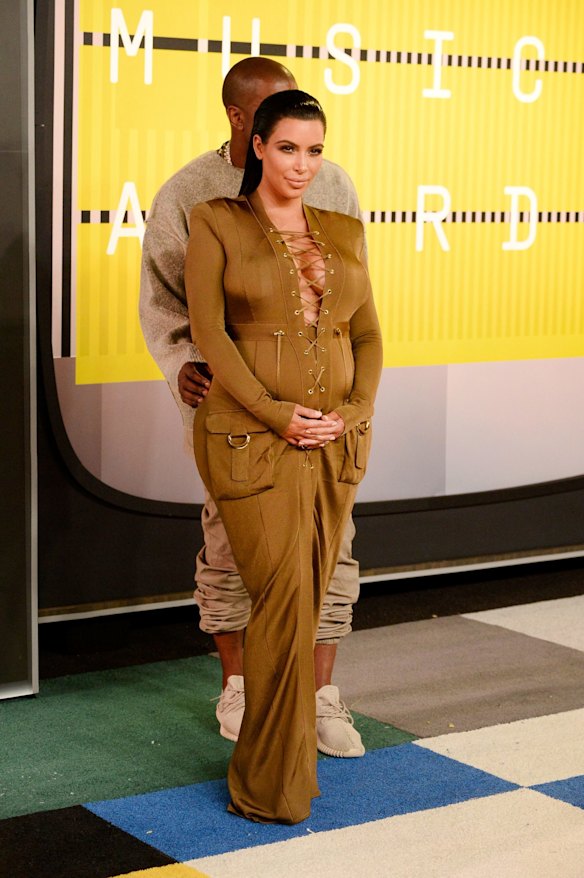LOS ANGELES, CA - AUGUST 30:  Recording artist Kanye West (L) and tv personality Kim Kardashian attend the 2015 MTV Video Music Awards at Microsoft Theater on August 30, 2015 in Los Angeles, California.  (Photo by Frazer Harrison/Getty Images)
