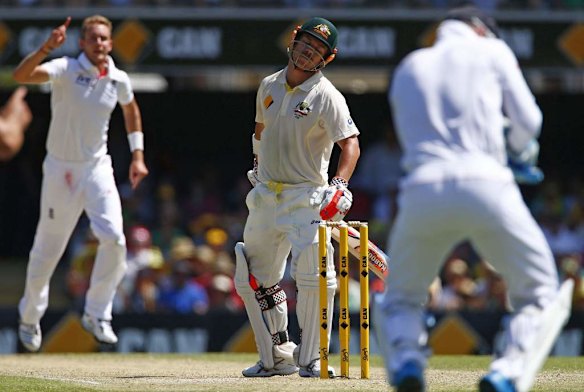 Australia's David Warner (C) reacts after he was caught out by England's wicket keeper Matt Prior (R) while Stuart Broad celebrates taking his wicket.