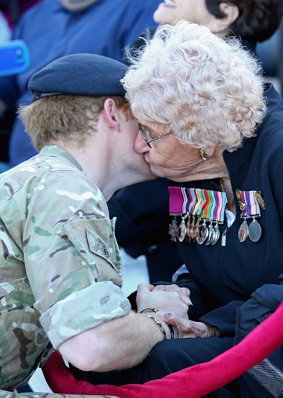 Prince Harry meets Daphne Dunne (wearing her husbands Victoria Cross). Prince Harry is visiting Sydney following a month-long deployment with the Australian Army.  