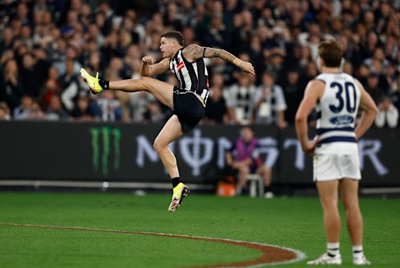 Almost: This long-range shot from Jack Crisp would have won the game for the Pies, but it sailed wide.