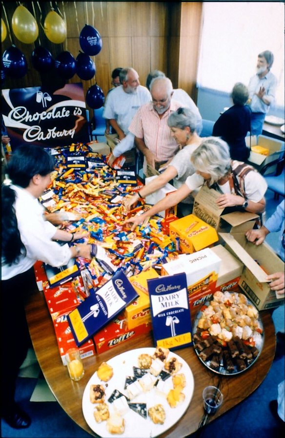 A feeding frenzy of volunteers from Dinosaur Cove at Cadbury’s Ringwood chocolate factory in February 1998.