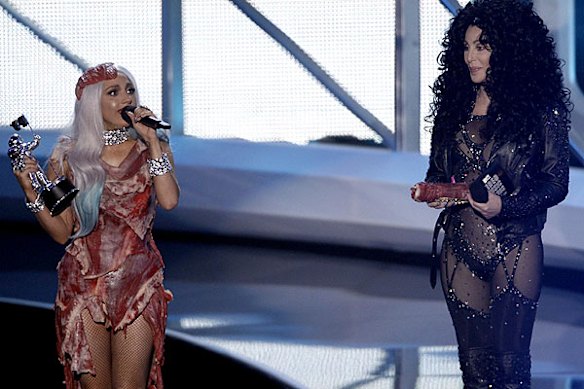 Stars collide ... Lady Gaga accepts an award from Cher.