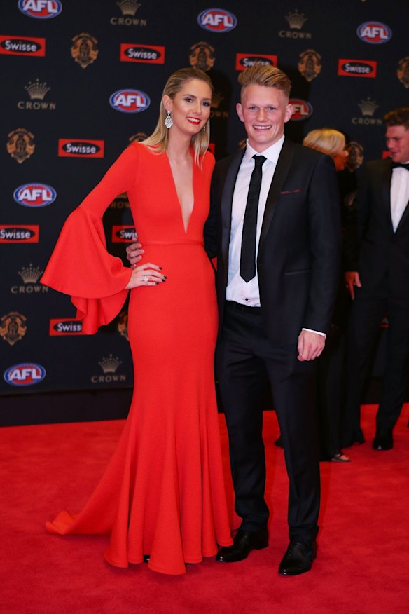 Adam Treloar of the Collingwood Magpies and Kelsey Tomkins pose on the red carpet ahead of the 2016 AFL Brownlow Medal count at Crown Palladium on September 26, 2016 in Melbourne, Australia.