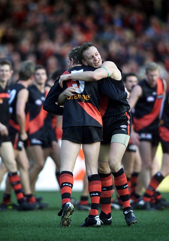 Greatest comeback: James Hird and John Barnes embrace after the Bombers' amazing turnaround in round 16, 2001

