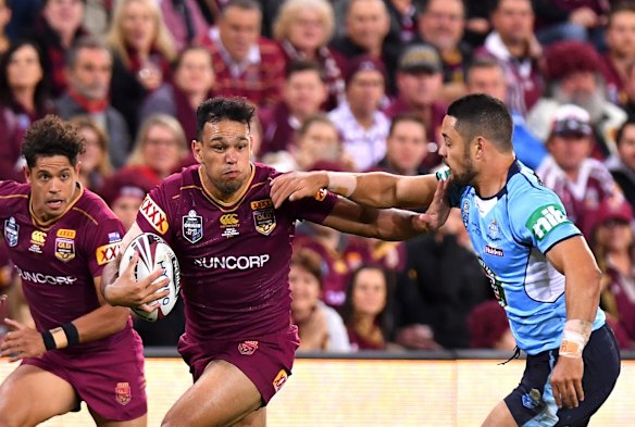 Will Chambers of the Maroons breaks away from the defence.