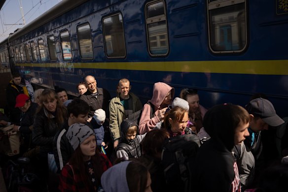 People board an evacuation train to Lviv in Kharkiv, Ukraine. 