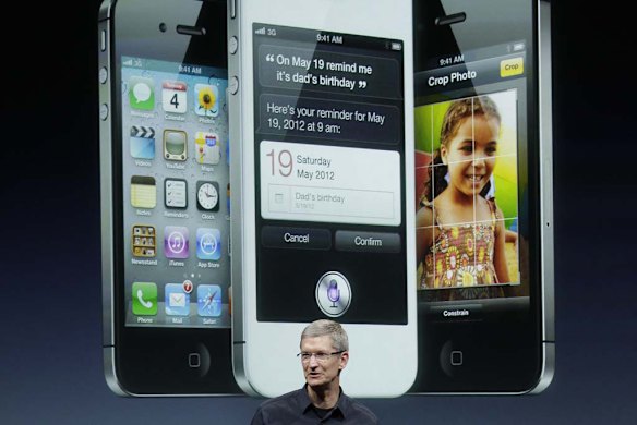 Apple CEO Tim Cook talks about the iPhone 4S during an announcement at Apple headquarters.