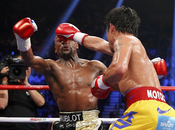 Manny lands a right against Floyd.