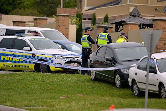 Cars lined up near the scene of the shooting, where a terror suspect was gunned down after two police officers were stabbed repeatedly.