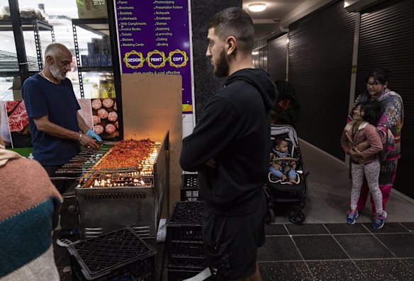 A customer waits for his order in Haldon Street.