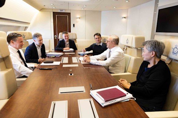 Prime Minister Anthony Albanese and Minister for Foreign Affairs Penny Wong during a meeting on the flight from Canberra to Tokyo to attend the Quad leaders' summit.