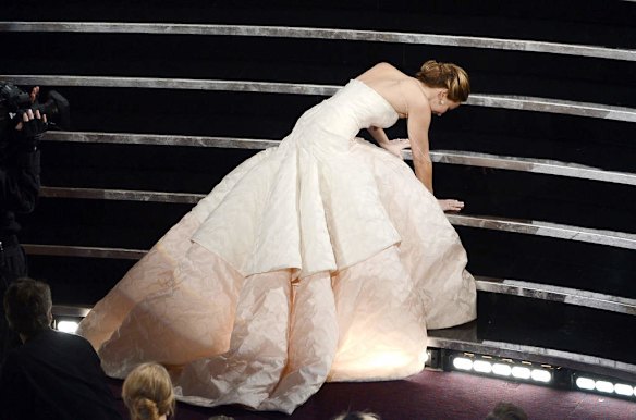 Actress Jennifer Lawrence falls on stage during the Oscars.