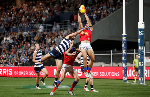 Cam Rayner flies for a mark over Jack Henry.