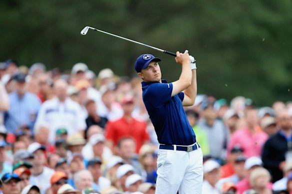 Jordan Spieth hits his tee shot on the 12th hole.