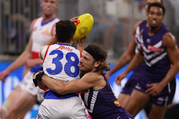 I’ve got you: The Dockers’ James Aish tackles Riley Garcia on Saturday night.