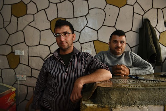 Brothers Raman, aged 35 years (left) who was kidnapped by the Free Syrian Army and Aram, aged 31 years (right) in their kebab shop in Basirma refugee camp in Iraqi Kurdistan. Aram has a son who doesn't talk because of the trauma of the war. They do not want to return to Syria at this stage. 