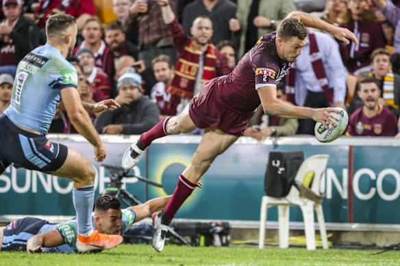 Corey Oates of the Maroons scores a try.