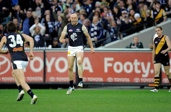 Chris Judd celebrates a goal.