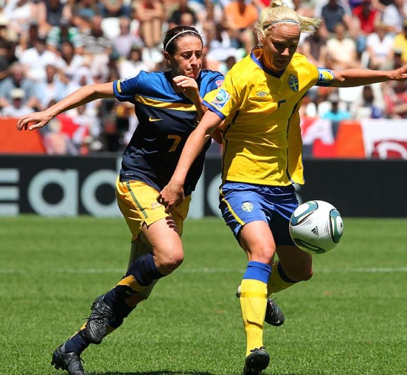 In her Matildas days, Heather Garriock (L) and Sweden's midfielder Caroline Seger vie for the ball.