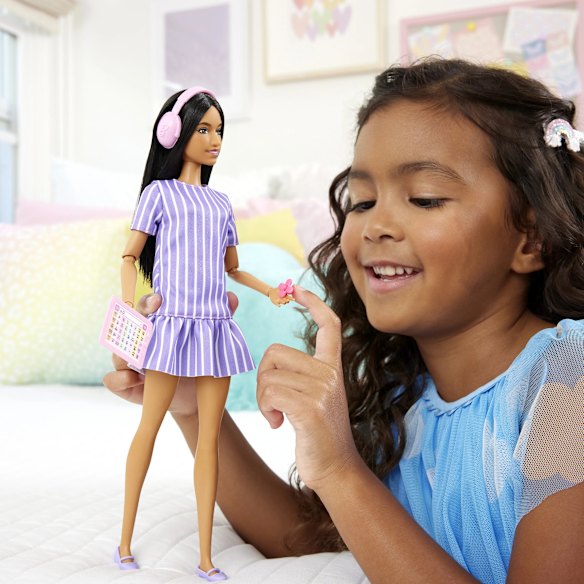 Mattel’s first autistic Barbie wears noise-cancelling headphones and carries a fidget spinner and Augmentative and Alternative Communication device.