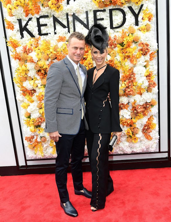 Lleyton and Bec Hewitt in Sass and Bide are seen in the Birdcage during Melbourne Cup Day.