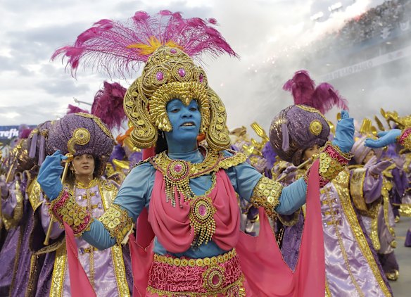 Dancers from the Gavioes da Fiel samba school perform during a carnival parade in Sao Paulo, Brazil, Sunday.