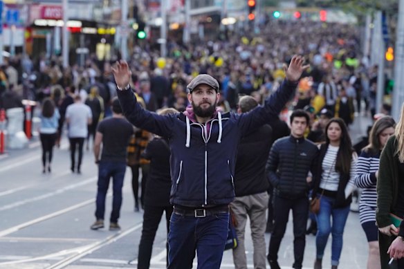 Richmond supporters celebrating their teams win over Adelaide during the AFL Grand Finals in Swan st Richmond. Photo Luis Enrique Ascui
