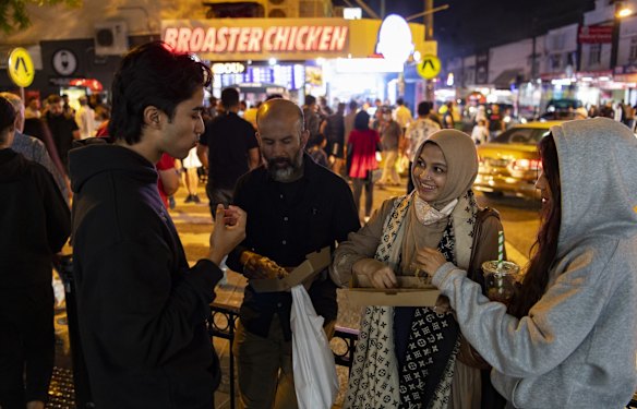 Ahsanullah Ahsan with his wife Farhana, daughter Farheen and son Adib visiting food stalls in the evening along Haldon Street, Lakemba.