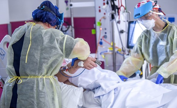 ICU nurses at work on a patient. 