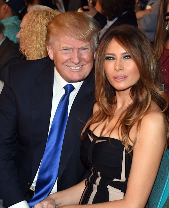 Donald Trump and model Melania Trump pose ringside.