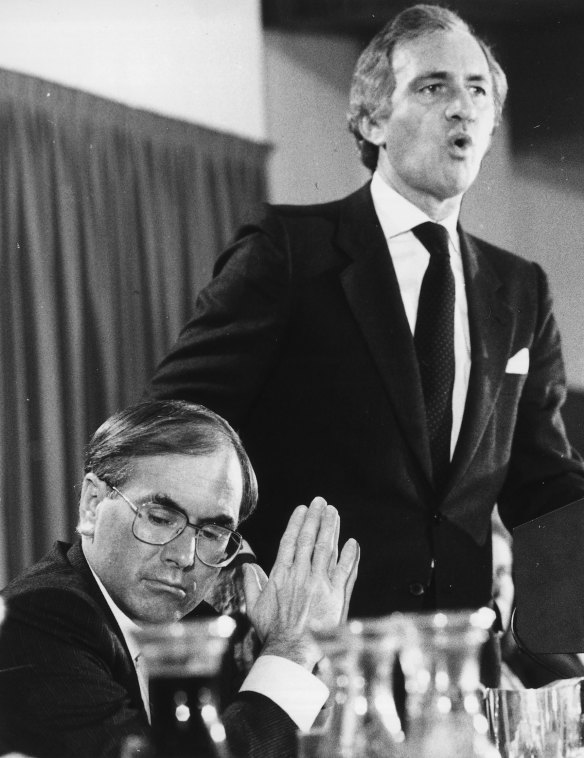Andrew Peacock launches his economic policy at the National Press Club on 12 April 1984 while John Howard listens. April 12, 1984.