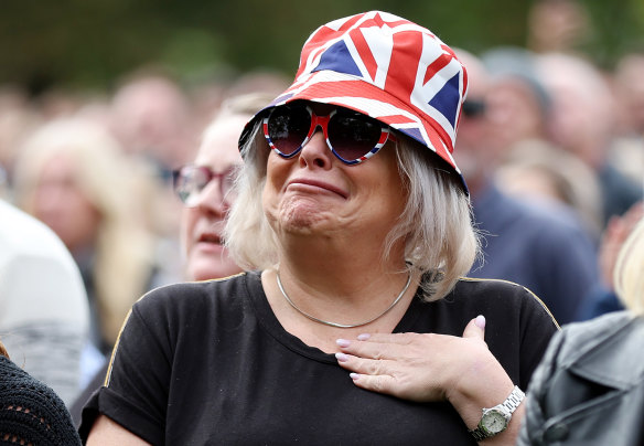 A mourner says her last farewell to the monarch.