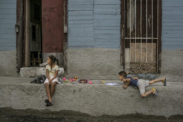 Children outside a home near the Latinoamericano stadium.