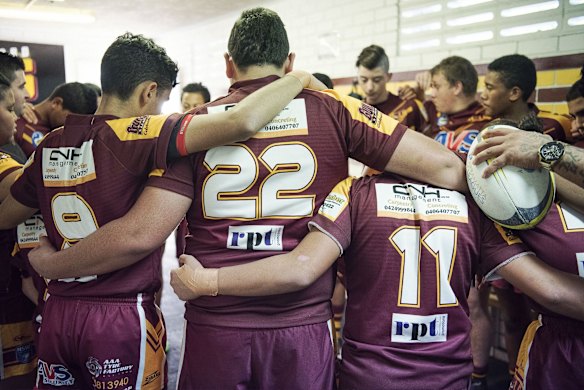 The team discusses the game prior to heading out for warm ups and the team prayers.