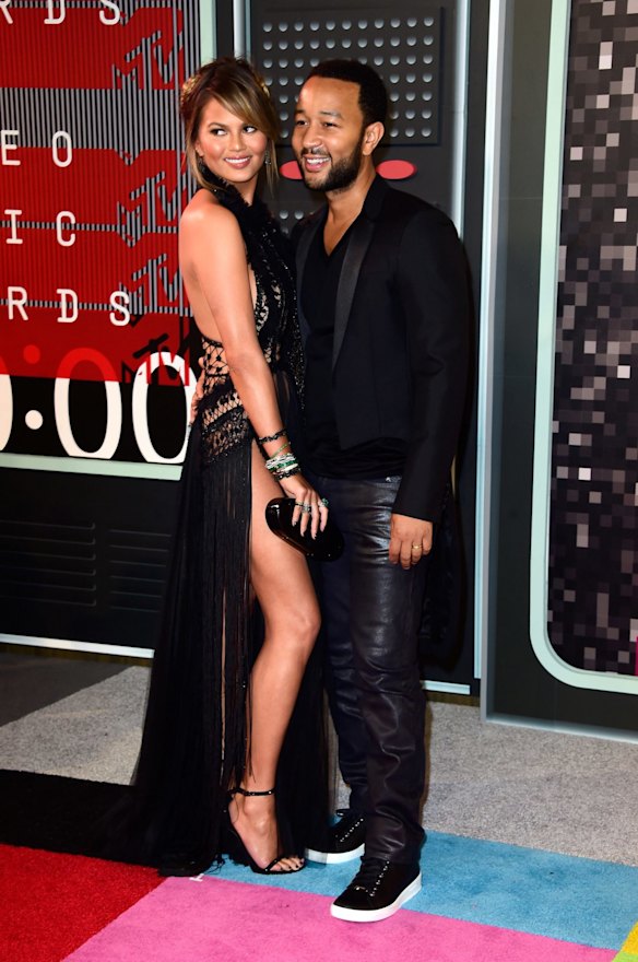 LOS ANGELES, CA - AUGUST 30:  Model Chrissy Teigen (L) and recording artist John Legend attend the 2015 MTV Video Music Awards at Microsoft Theater on August 30, 2015 in Los Angeles, California.  (Photo by Frazer Harrison/Getty Images)