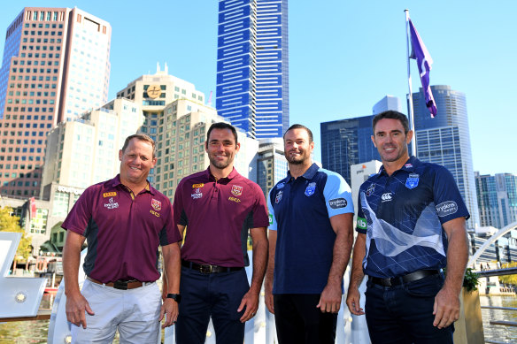 State against state: Maroons coach Kevin Walters (left) and Blues boss Brad Fittler (right) with their skippers. 