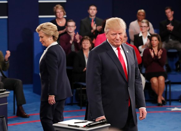 Democratic presidential nominee Hillary Clinton and Republican presidential nominee Donald Trump arrive before the second presidential debate.