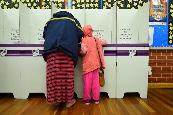 Salanieta Vuniwa with her daughter Apikali Vuniwa votes at Blacktown South Public School.