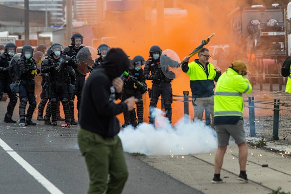 Flares are let off near Police near the Westgate Bridge. 