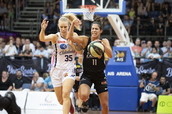 Adelaide Lightning's Nicole Seekamp tries to slow the Capitals' Kia Nurse.