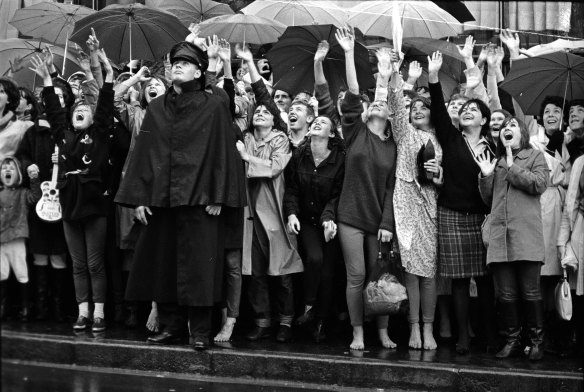 "Outside the Beatles' hotel, the Sheraton, in Macleay Street, Potts Point, 300 fans awaited in the rain."