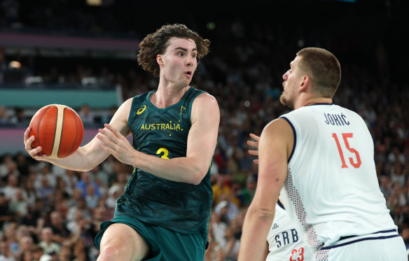 Hurt locker: Josh Giddey takes on fellow NBA star Nikola Jokic in the Australia-Serbia quarter-final at the Paris Olympics.