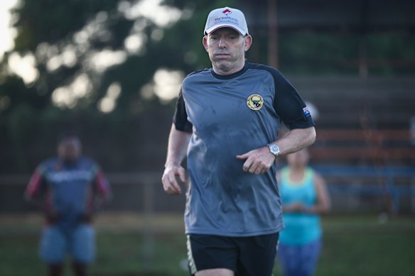 Prime Minister Tony Abbott doing physical training with members of the Bamaga community, during his visit to Cape York, on Friday 28 August 2015. 