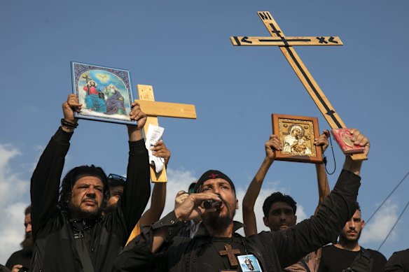 Anti-vaccine protesters holding crucifixes and icons, shout slogans during a rally at Syntagma square, central Athens. Thousands of people protested against Greek government's measures to curb rising COVID-19 infections and drive up vaccinations in the country where almost 50% of Greeks have received at least one dose of the vaccine.