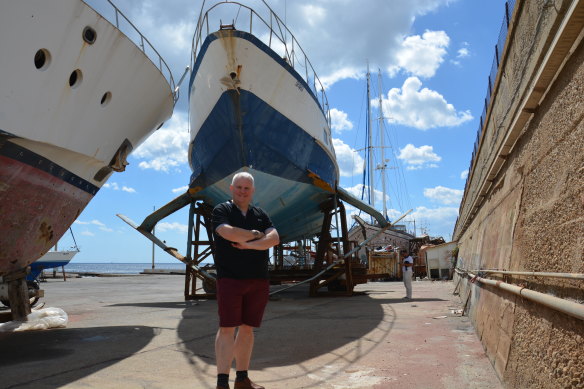 Andrew Heighway with the old Sydney hydrofoil (the Curl Curl) being restored in Messina, Italy where it was built in 1972.