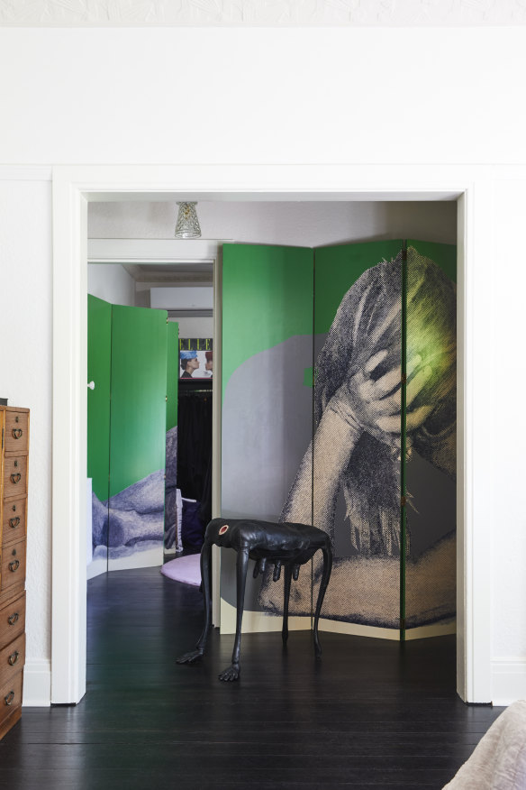 Upstairs, two bedrooms have been converted into large dressing rooms which flank the main bedroom. A large screen artwork by Simon Leah fills the hallway.