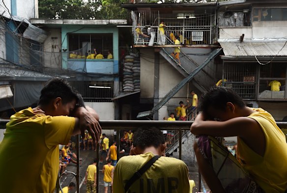 Inmates sleep on a rail in Quezon City Jail, Manila, Philippines. 