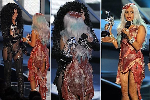 Here, hold my purse ... Lady Gaga gives Cher a hug.