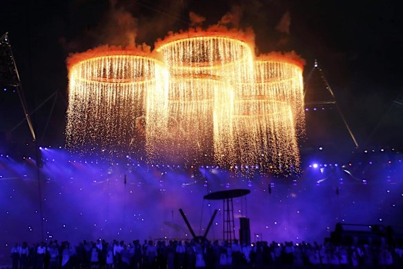 The Olympic rings are seen during a pyrotechnics display at the pre-show before the opening ceremony.